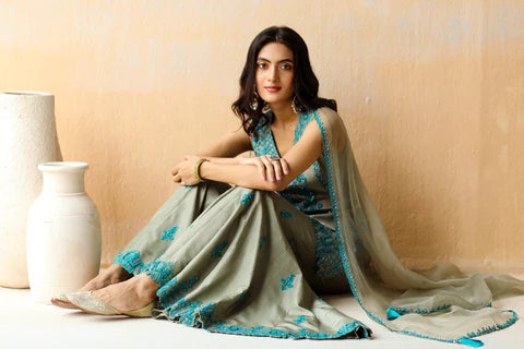 Discover Graceful Ensembles with Aman Takyar: Green Sharara Set, Ivory Lehenga Set, and Ivory Saree